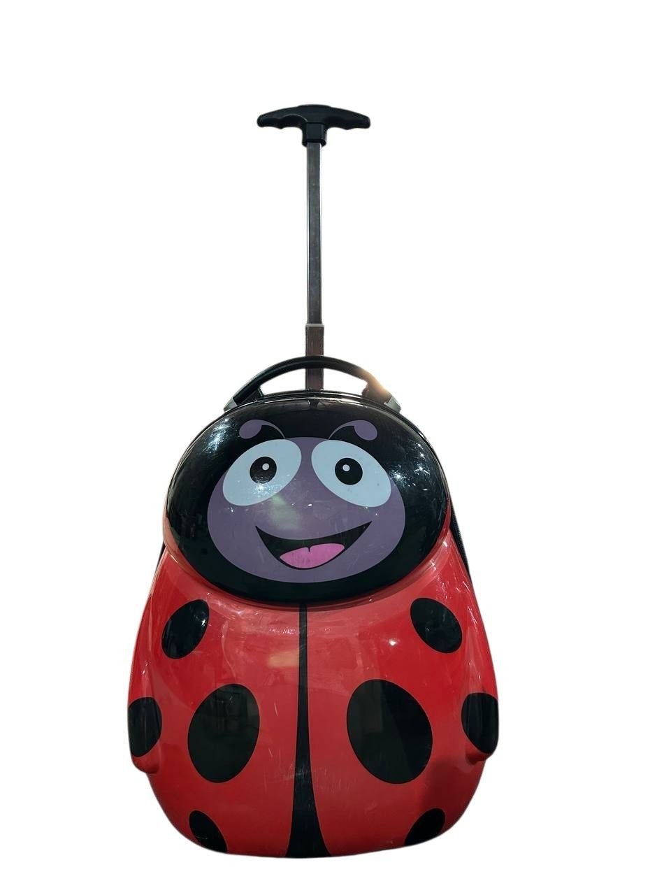 This is a Heys Kids' Cuties Ladybug Hardside Rolling Suitcase